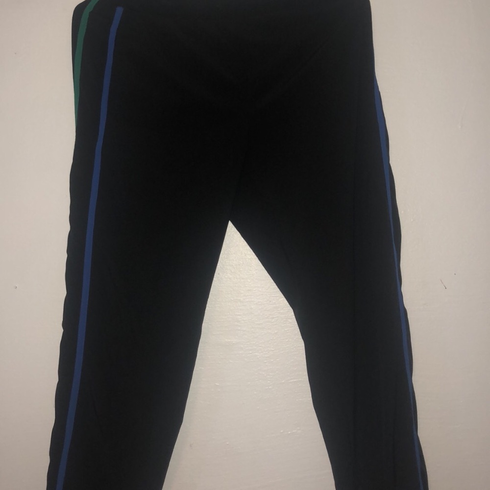 Black joggers with blue and green stripes on side